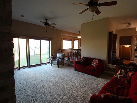 View from living room into the kitchen and main entrance of