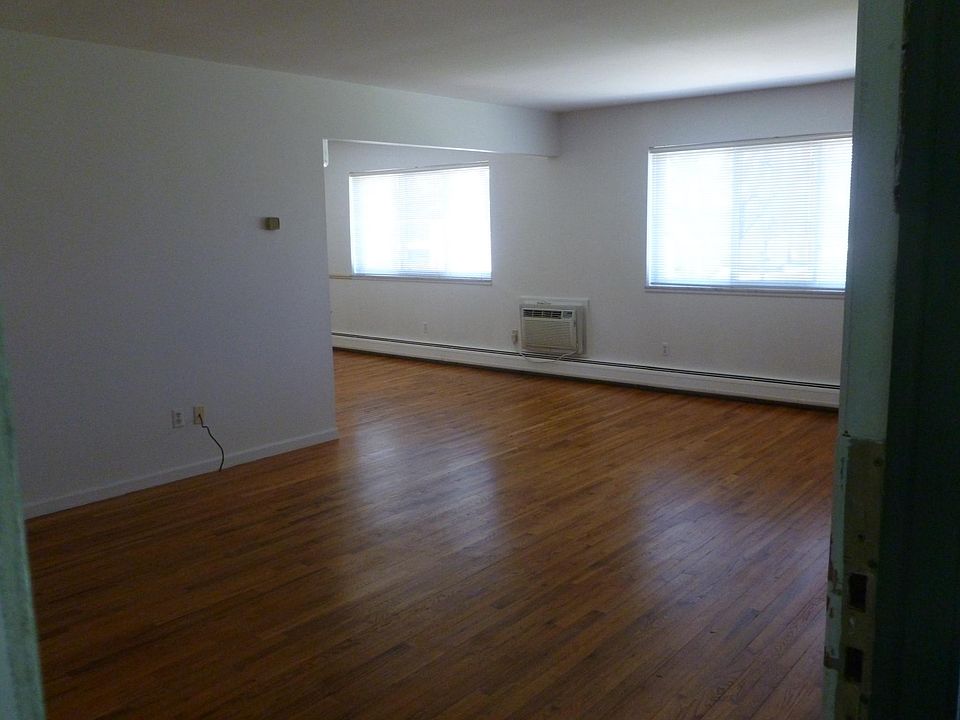 Entry into living room with dining L to the end left