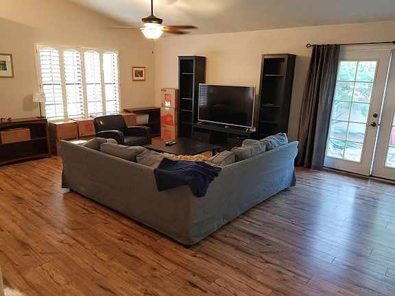 Large family room with french doors leading out the the side patio area.