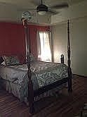 master bedroom with tray ceiling