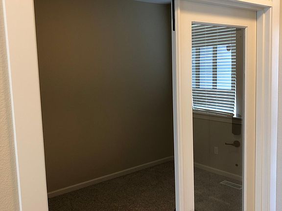 Large executive office with duel glass doors.