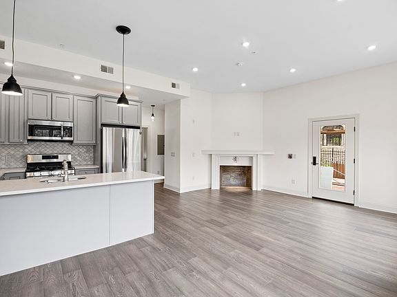 Kitchen, Fireplace, & Entryway