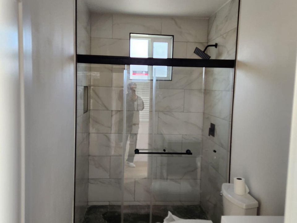 Tiled to the ceiling -- gorgeous porcelain tiles and spacious bathroom.