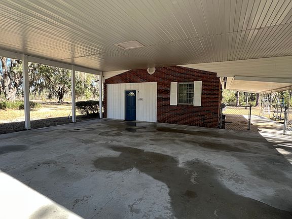 Covered carport, back covered porch and side entry