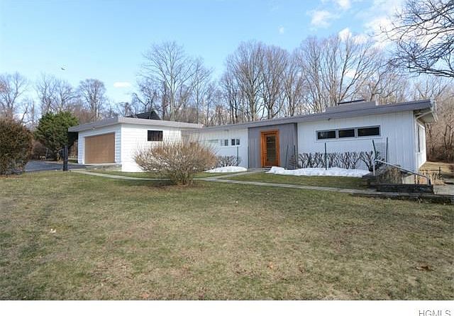 Front house with separate two car garage.