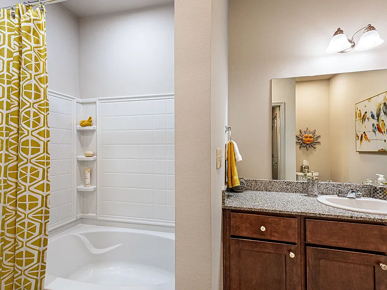 Bathroom with ceramic tub and shower