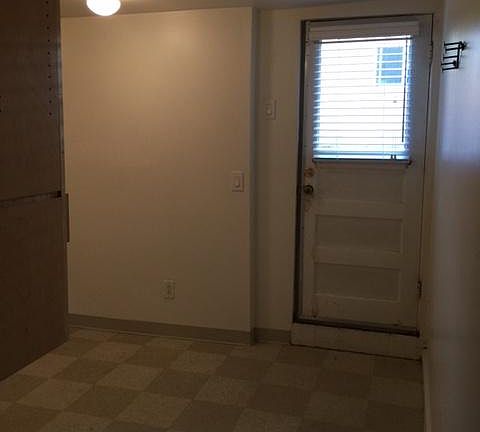 Entry door and kitchen area.