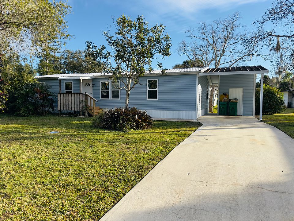 front of the House with Shed and Driveway
