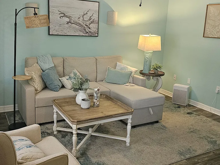 Living room with sleeper sofa that has storage