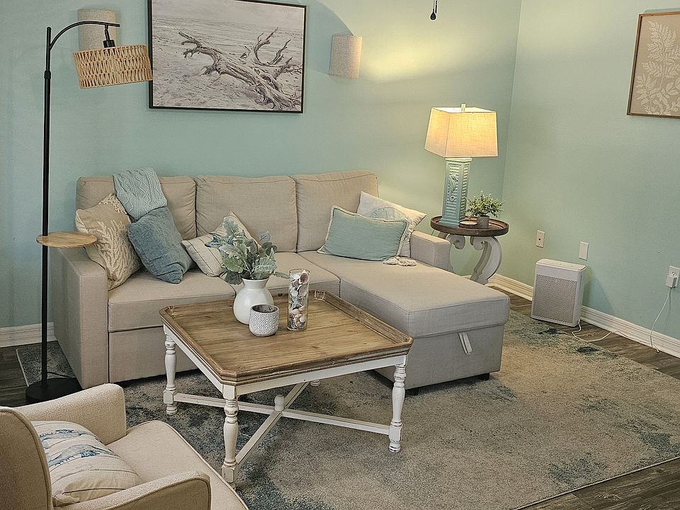 Living room with sleeper sofa that has storage
