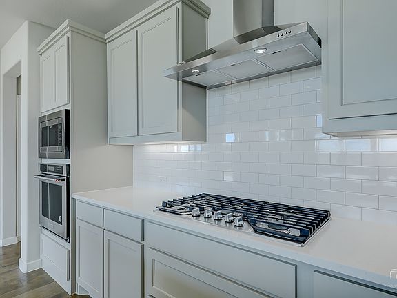 Kitchen in the Mercury home plan by Trophy Signature Homes - REPRESENTATIVE PHOTO