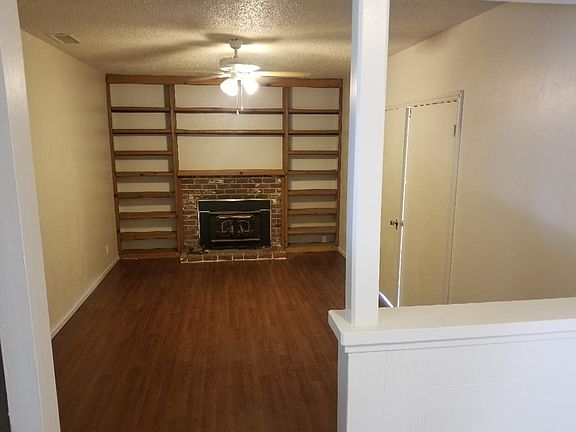 den with wood burning fireplace insert