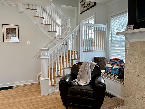Living room with steps going to 2nd floor.