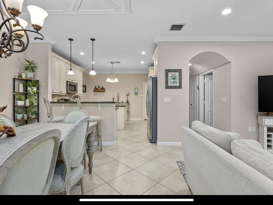 Photo from back of downstairs. Living room on right side... TVs are not included*