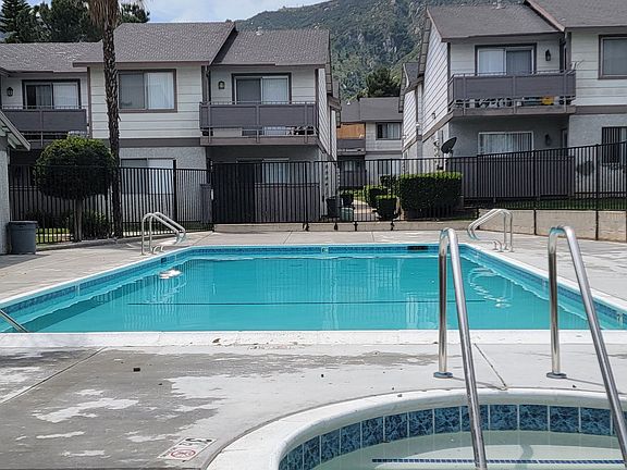 Swimming pool and spa at Grand Oaks Apartments in Lake Elsinore, California.