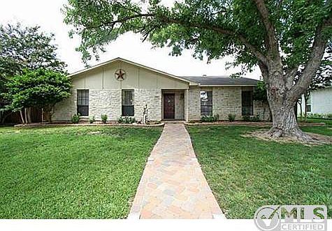 Great curb appeal with mature trees, Pavestone walkway and Austi
