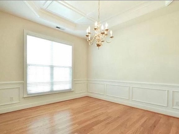 Dining Room with Tray Ceiling and Chair Rail Moulding