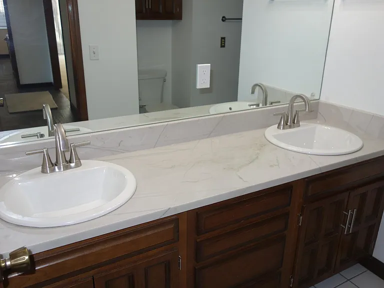 Jack and Jill style bath with double sinks. between 1st and 2nd bedrooms.