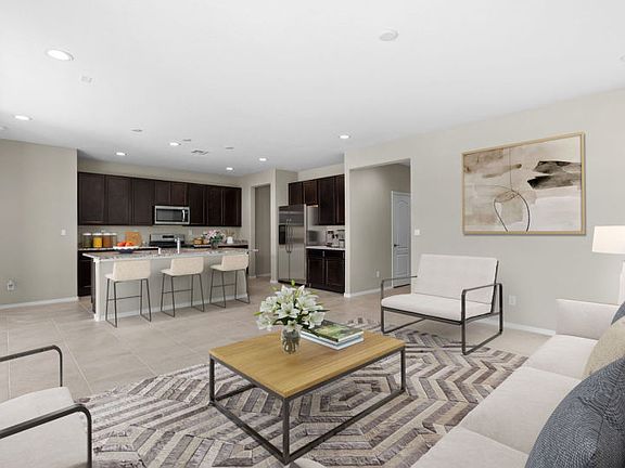 Open living concept with gathering room, kitchen, and cafe.