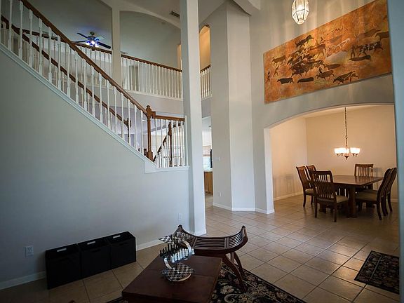 This provides the view of the entrance to the family room and kitchen as well as the dramatic stairw
