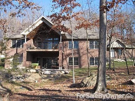 Back view
						:
						Deck and patio have a great southern view of woodlands.