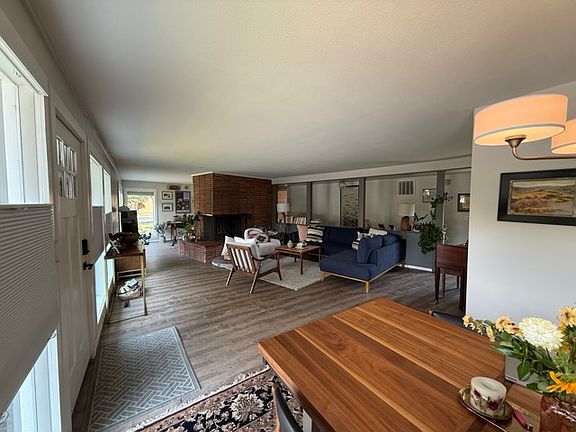 Living room view from the dining room. Den sits behind the fireplace.