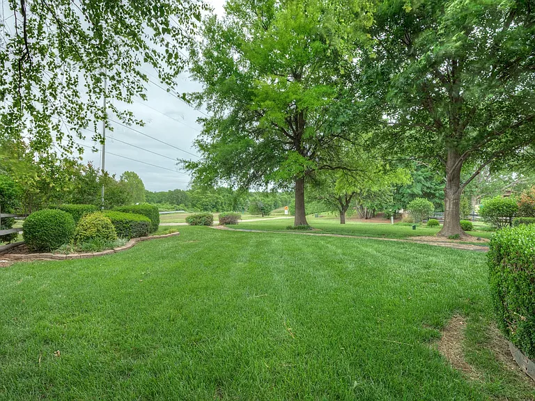 Lush yard on well water and don't forget mowing and yard maintenance included in the lease price.