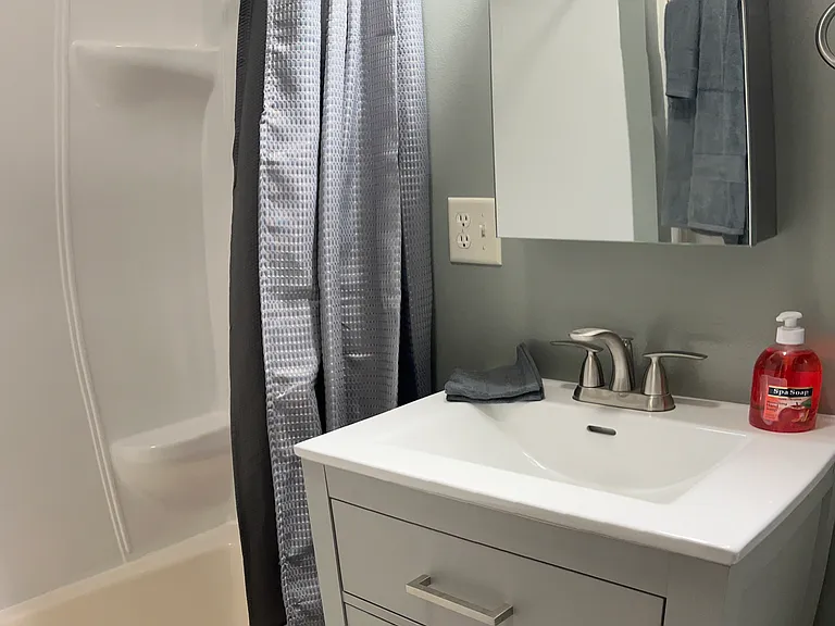Newly updated bathroom, with tub/shower.
