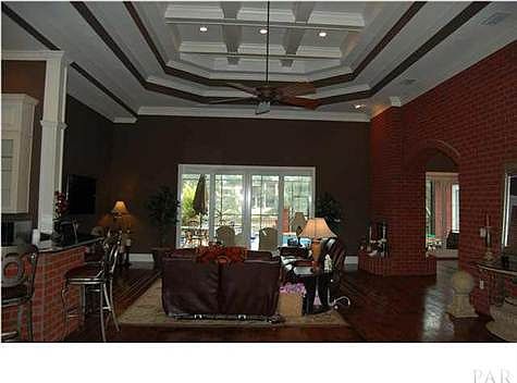 A deep coffered ceiling in the living room adds style and elegance