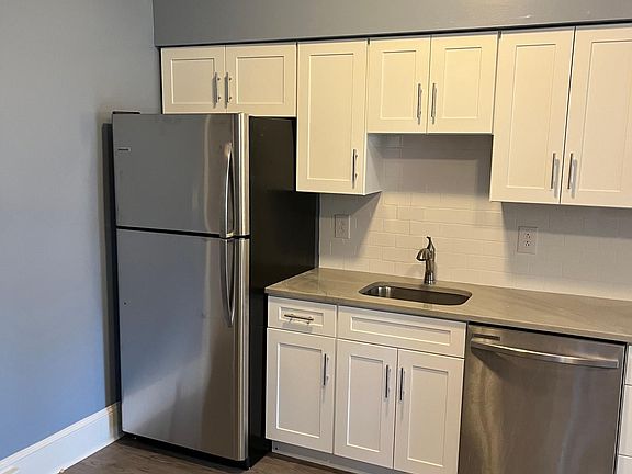 Freshly painted, remodeled kitchen with new cabinets, countertop, and appliances.
