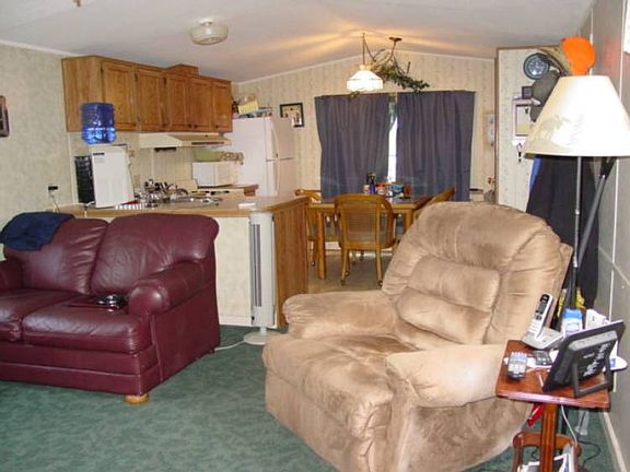 Front kitchen is open and features a nice eating area.