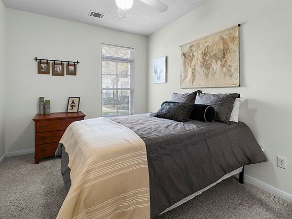 Study in comfort with a fully furnished bedroom and desk at The Quarters, student housing near UL Lafayette.
