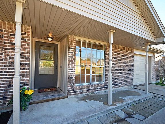 Shaded front porch perfect for rocking chairs! STorm doors on both the front door and back door!