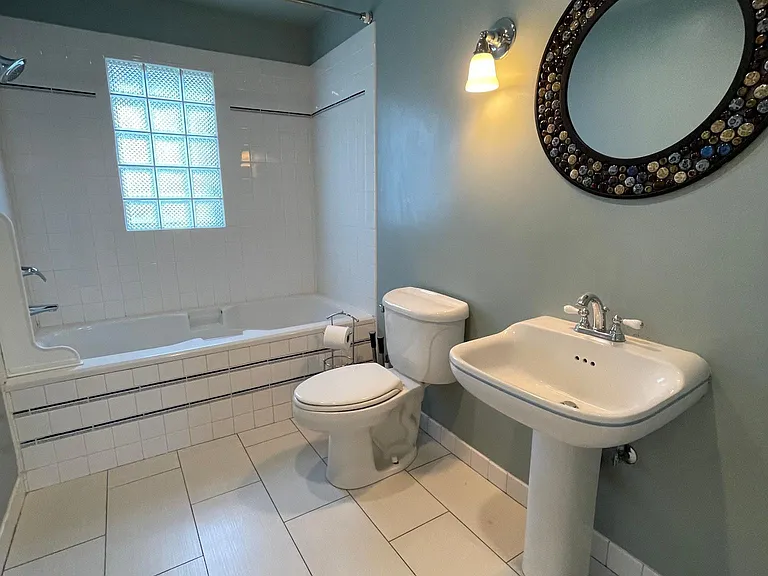 Main floor bath has full bath with shower and deep soaking tub.
