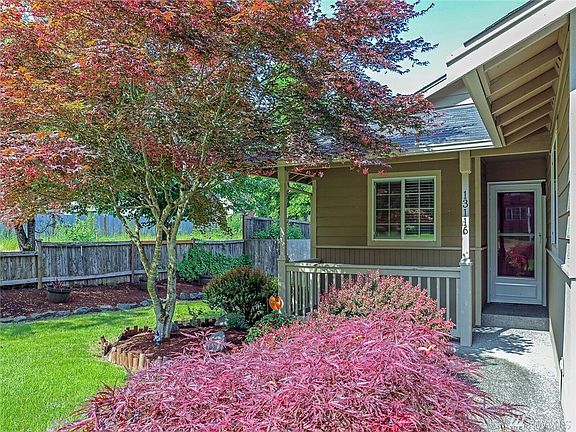 Cute Covered Porch & Mature Landscaping