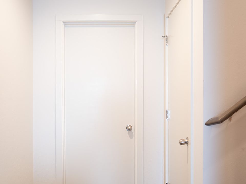 First floor hallway. Entrance to first bedroom, additional closet and stairway to second floor