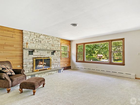 The 17x15 living room is filled with natural light.  Brand new carpet and fresh paint in June 2020