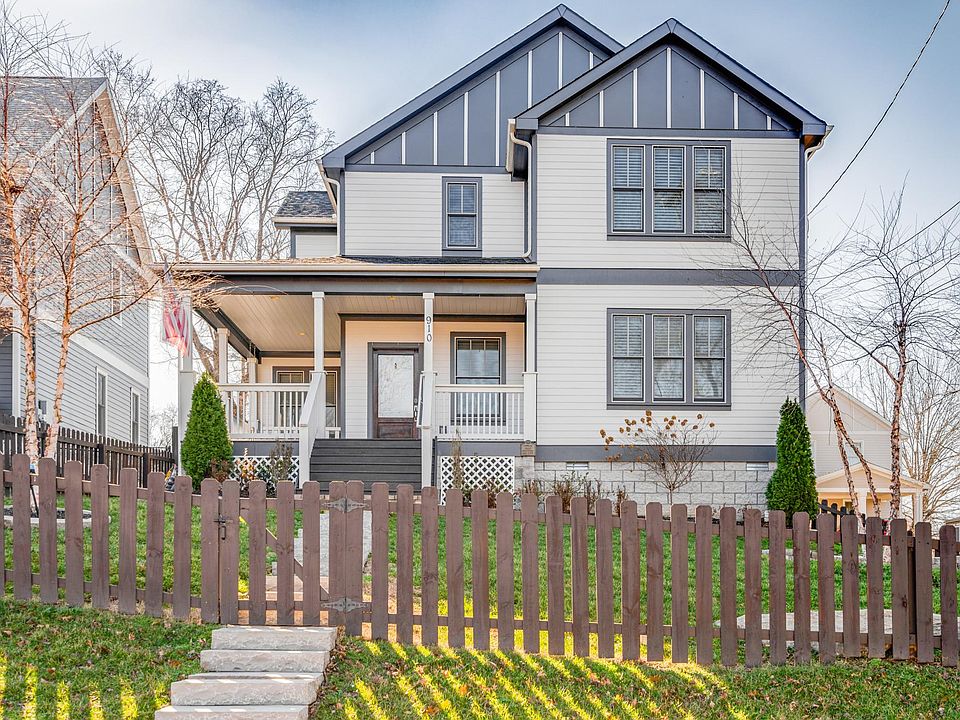 Fenced in front and backyard with covered porch and porch swing!
