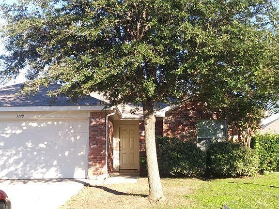 2 car garage includes Overhead Garage door opener. Yard has Sprinkler System.
