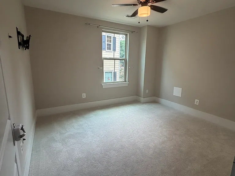 Spacious Bedroom #2 with ample natural light and generous closet space.