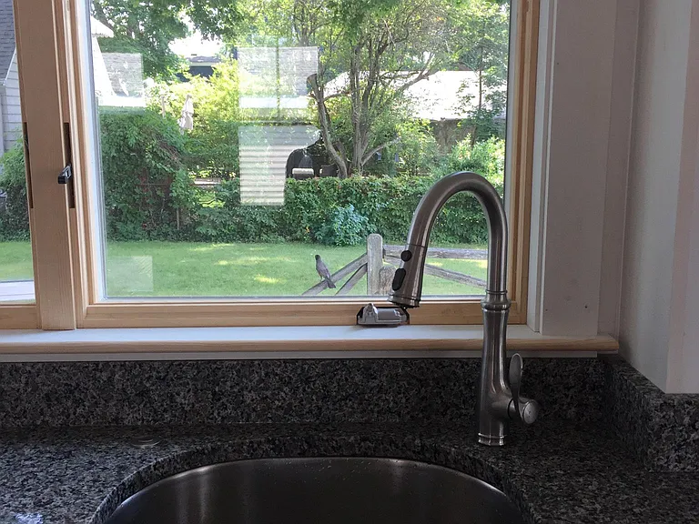 Kitchen overlooking private backyard