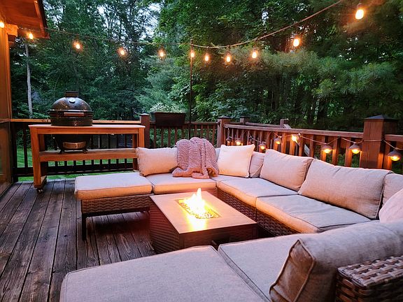 Wonderful relaxing outdoor living on the large private back deck with ambience lights, fire feature & Green Egg.