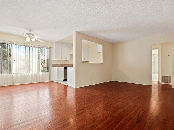 Living room, dining room, and kitchen.