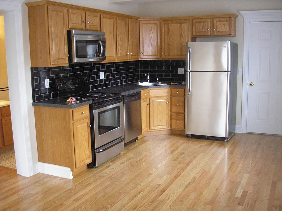 great kitchen has electric stove, microwave, dishwasher, refrigerator, room for a table