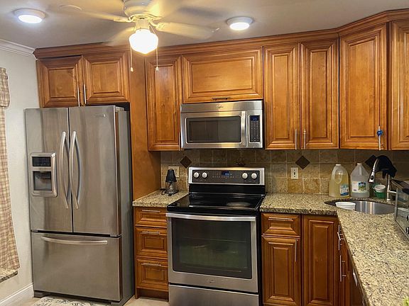 The kitchen has open area between it and the dining area.