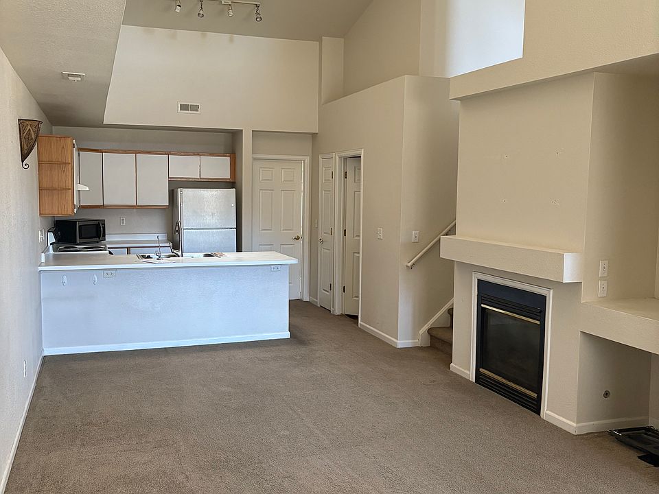 Living Room and Kitchen. Spacious and open floor plan. Vaulted Ceiling. Skylights for added natural sunlight.
