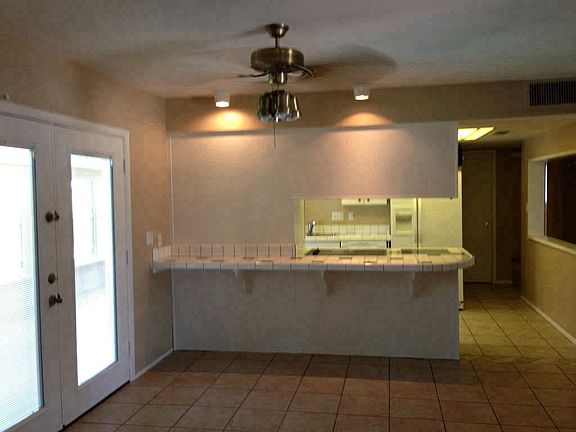View from family room towards kitchen and Pella doors to Ari