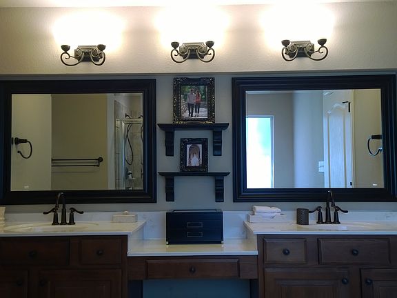 Master bath/vanity with custom mirrors, lighting, faucets, a