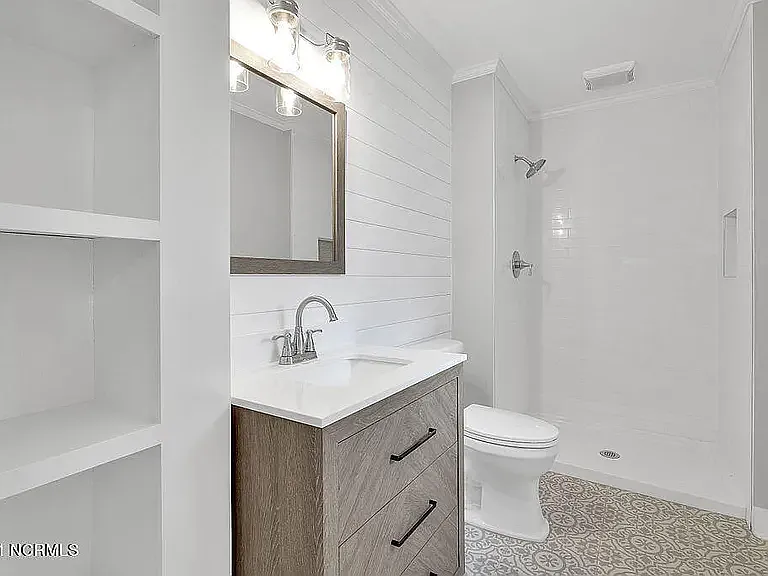 *original listing photo from when we purchased the home (downstairs full bathroom)