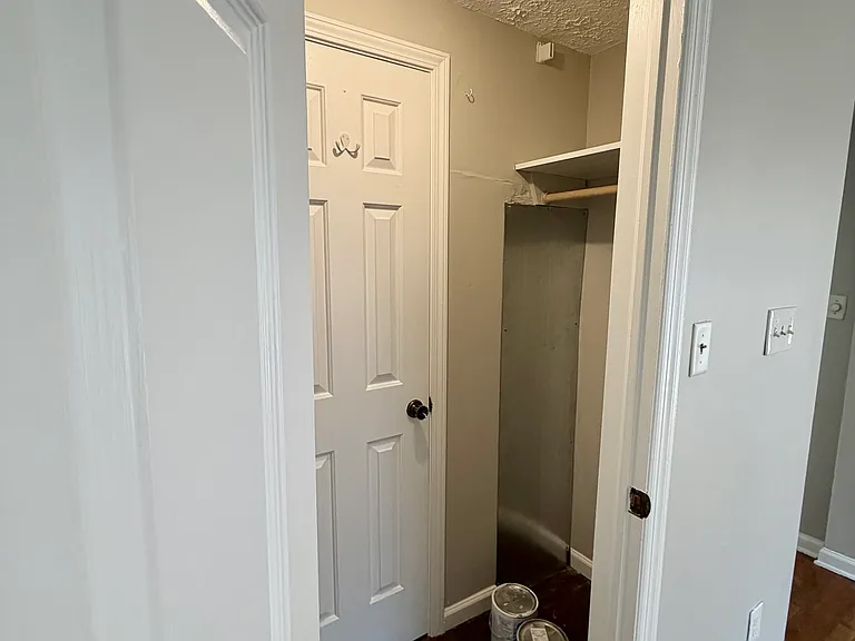 Hanging space on the right side of the closet. There is some additional storage behind the door where the newer HVAC and hot water heater is stored.